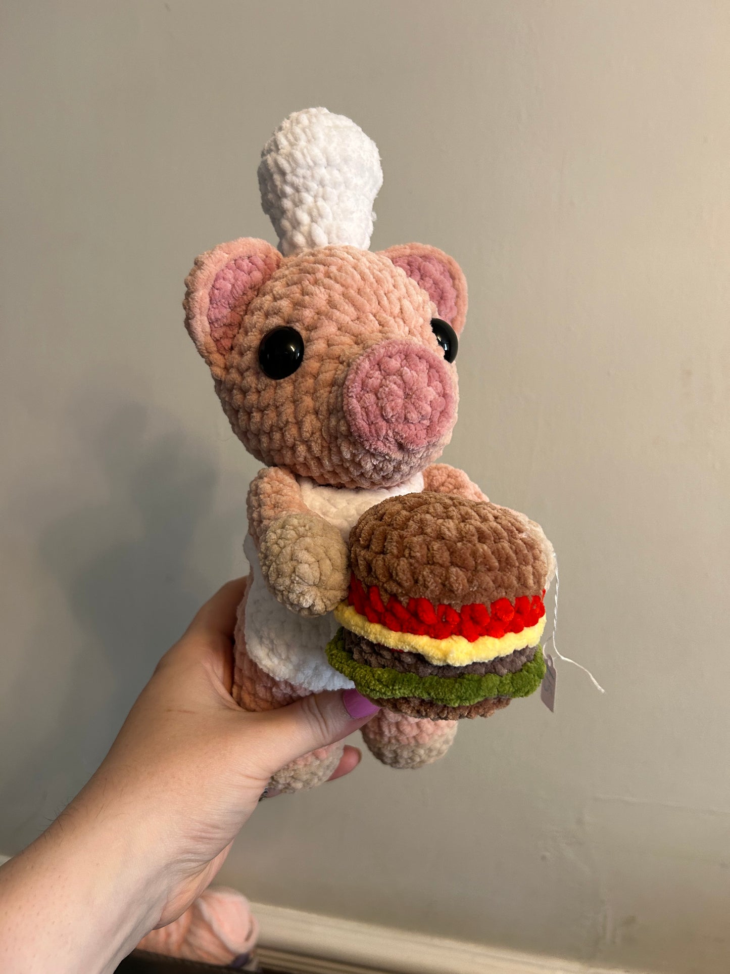 Chef pig with burger